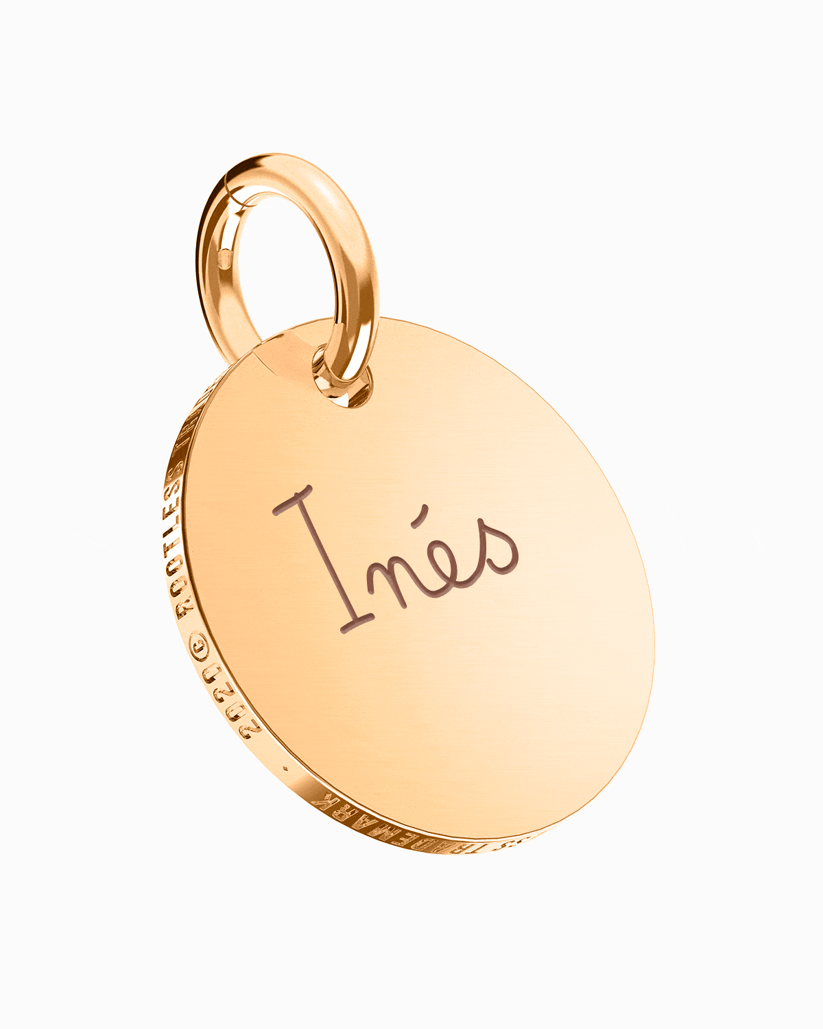 Colgante Circle® en oro rosa con el nombre Inés grabado, en perspectiva