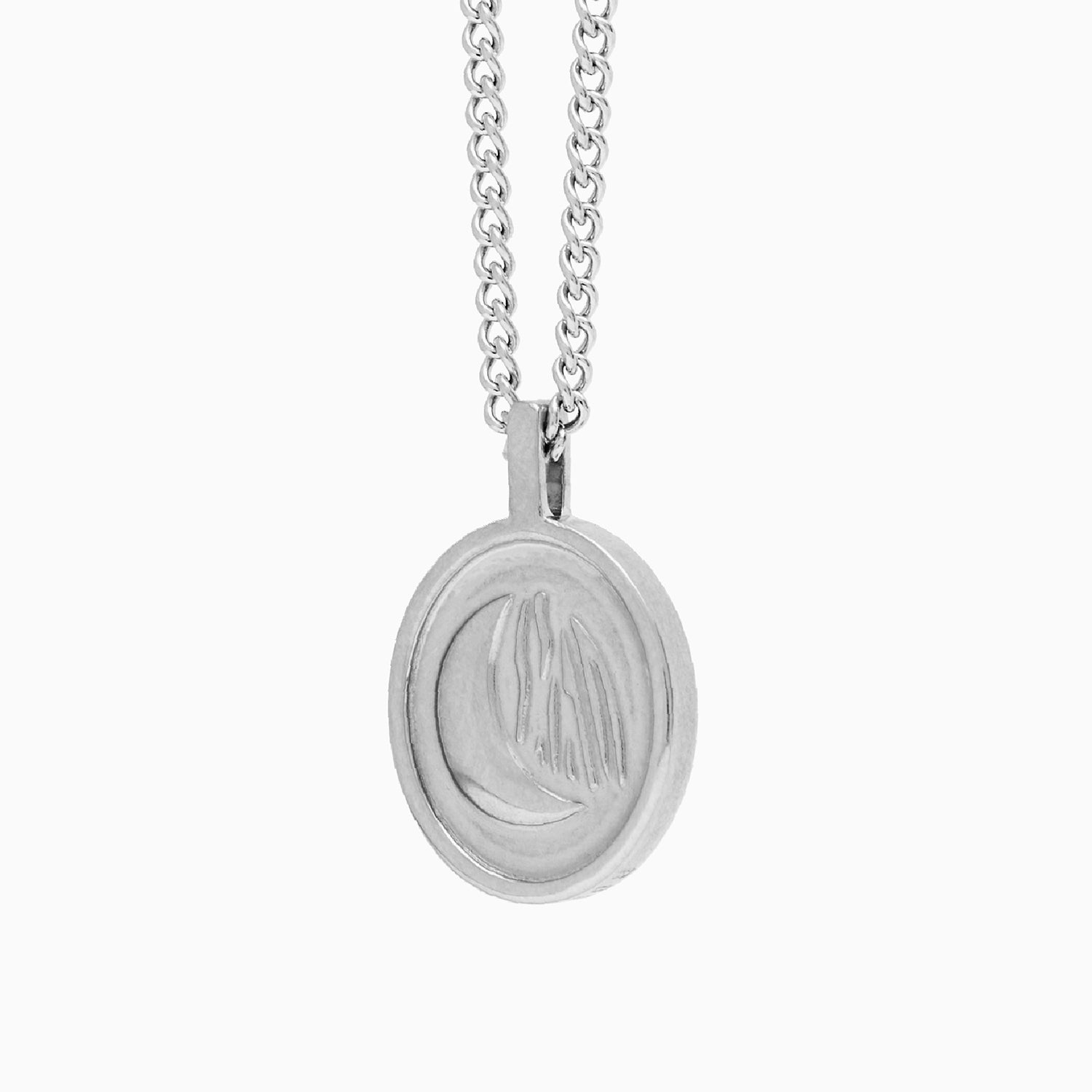 Reverso de la medalla Sentinel® en acero con el relieve de luna